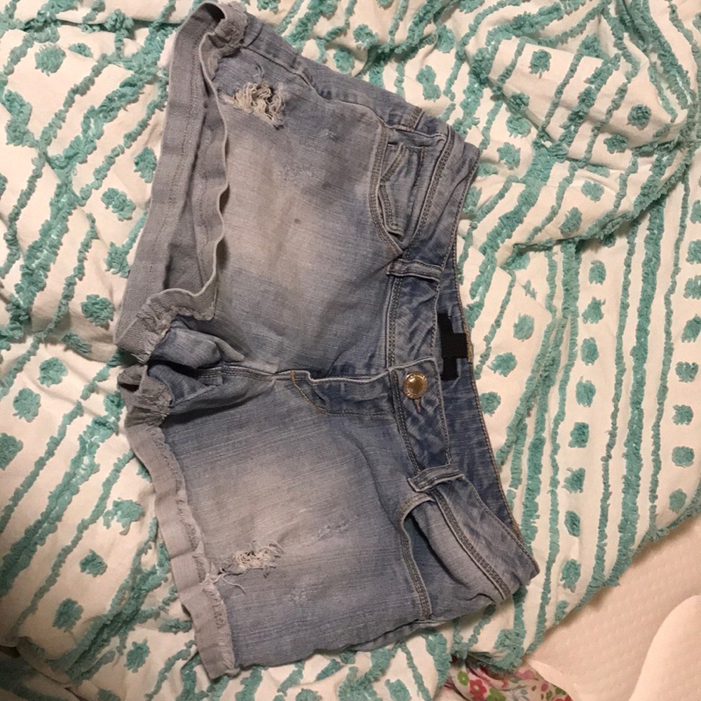 Ripped blue jean shorts